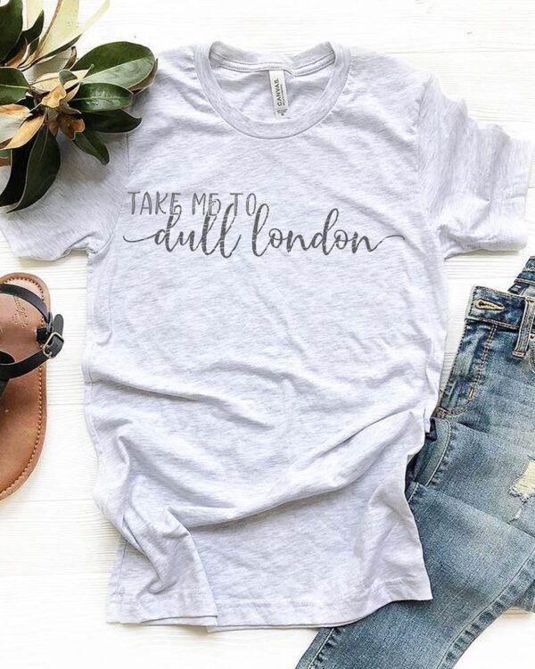 flat lay of light grey dull london boyfriend tee with ripped jeans and sandals
